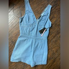 Denim Romper Trendy High Rise Denim Jumpsuit For Summer, Casual Mid-rise Denim Jumpsuit For Summer, Casual Mid-rise Summer Denim Jumpsuit, High Rise Dark Wash Denim Jumpsuit For Summer, Spring Denim Jumpsuit Short Length, Spring Dark Wash Mid-rise Denim Jumpsuit, Spring High Waist Denim Jumpsuit For Day Out, High Rise Blue Denim Jumpsuit For Summer, Spring High-waisted Denim Jumpsuit For Day Out