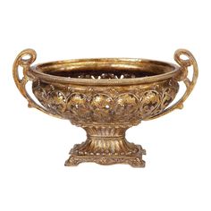 an ornate brass bowl with handles and filigrees on the sides, set against a white background