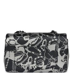 This mini Rectangular flap bag is of black and silver printed lambskin leather with ruthenium tone hardware and has a front flap with signature CC turnlock closure, rear half moon pocket, single interwoven black leather and ruthenium tone chain link shoulder/crossbody strap.The interior is lined in black leather and features a zipper pocket with Chanel pull and an open pocket below.Collection: 22C (RFID Chip)Origin: FranceCondition: New and never worn (plastic on hardware)Accompanied by: Chanel box, Chanel dustbag, felt, RFID, retail UPCMeasurements: 8" width x 5" height x 2.5" depth; 22.5" strap drop Designer Flap Bag With Silver-tone Hardware For Daily Use, Rectangular Flap Bag With Silver-tone Hardware For Daily Use, Luxury Designer Flap Bag With Silver-tone Hardware, Luxury Double Flap Bag With Silver-tone Hardware, Black Rectangular Flap Bag With Silver-tone Hardware, Chanel Mini Rectangular, Chanel Box, Chanel Mini, Hermes Birkin 25