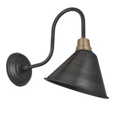 a black and gold wall light with an arm on the left hand side, it has a metal cone shade