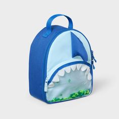 Carrying lunch to school, picnics or road trips will be so much more fun for your child with this Shark Fashion Lunch Bag from Cat & Jack™. This lunch tote features a single zippered compartment to hold anything from snacks and sandwiches to fresh fruit. It also features a mesh pocket on the inside and an outer zip pocket for added storage space, and a tote handle makes it easy to carry. Made from 100% recycled polyester and featuring a dome-shaped silhouette, it features a shark fin accent on t Back To School Lunch Bag Backpack With Zipper, Playful Bags With Zipper Closure For Back To School, Playful Back To School Bag With Zipper Closure, Back To School Lunch Bag With Zipper, Playful Bag With Zipper Closure For Back To School, Playful Back To School Bags With Zipper Closure, Fun Lunch Box For Back To School Travel, Cute Lunch Box For Travel And Back To School, Cute Lunch Box For Back To School Travel