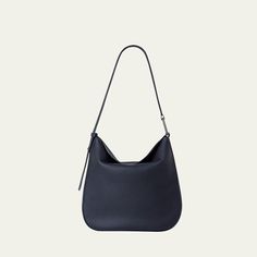 Akris "Anna" hobo bag in structured napa leather  Adjustable shoulder strap with signature trapezoid ring Fold-over flap top with magnetic closure  Interior, one zip pocket  Approx. 13"H x 13.8"W x 3.9"D Made in Romania Structured Hobo Bag For Everyday Use, Modern Structured Hobo Bag For Everyday Use, Modern Formal Crossbody Hobo Bag, Evening Structured Shoulder Bag With Smooth Grain, Modern Crossbody Hobo Bag With Smooth Grain, Everyday Structured Shoulder Bag With Smooth Grain, Modern Hobo Bag With Smooth Grain And Double Handle, Structured Shoulder Bag With Palladium Hardware For Everyday Use, Structured Shoulder Bag With Smooth Grain For Daily Use