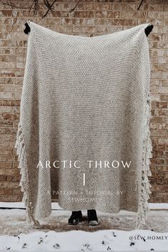 The Arctic Throw a pattern + tutorial by sew homey. A blanket is held up by a person against a brick wall with snow on the ground. How To Knit A Throw Blanket, Easy Knit Throw Blanket Free Pattern, Modern Knit Blanket, Knitting Pattern Throw Blanket, Chunky Throw Blanket On Bed, Chenille Knit Blanket, Knitting Inspiration Blanket, Beginner Blanket Knitting Patterns, Easy Blanket Knitting Patterns Free