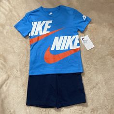 Nike Boys Outfit Size 7. Short Sleeve Shirt And Shorts. Blue Shirt And Navy Shorts. Brand New! Blue Short Sets For Spring, Blue Shorts For Playwear In Spring, Blue Playwear Shorts For Spring, Nike Blue Tops For Playwear, Sporty Blue Cotton Sets, Light Blue Casual Sets For Playwear, Nike Blue Cotton Sets, Blue Cotton Sporty Sets, Casual Blue Playwear Sets