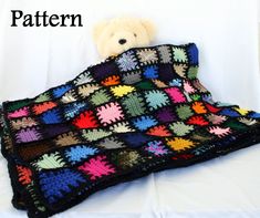 a crocheted blanket with a teddy bear sitting on top of it and the words pattern written below