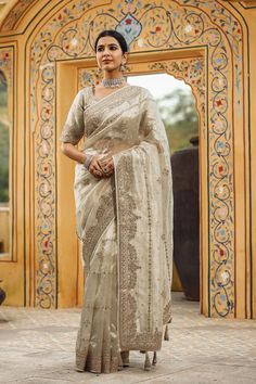 Buy silver embroidered organza silk saree online in USA with blouse. Make a fashion statement at weddings with stunning designer sarees, embroidered sarees with blouse, wedding sarees, handloom sarees from Pure Elegance Indian fashion store in USA.-full view Traditional Silver Tissue Silk Pre-draped Saree, Silver Traditional Wear With Intricate Embroidery For Designer Wear, Silver Traditional Wear With Intricate Embroidery For Eid, Silver Traditional Wear With Intricate Embroidery For Festive Season, Festive Silver Traditional Wear With Intricate Embroidery, Designer Silver Embroidered Dupatta, Designer Embroidered Silver Dupatta, Silver Pre-draped Saree With Zari Work For Festive Occasion, Semi-stitched Silver Traditional Wear With Resham Embroidery