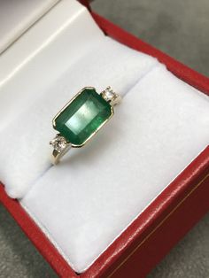 Gia Certified 14k Gold Emerald Cut Sapphire Ring, Heirloom Emerald Gemstone Ring For Promise, Heirloom Emerald Ring With Ethical Gemstones For Anniversary, Green 14k Gold Emerald-cut Rings, Green Emerald Cut 14k Gold Rings, Yellow Gold Emerald Cluster Ring With Center Stone, Green 14k Gold Ring With Accent Stones, Green 14k Gold Rings With Accent Stones, 14k Gold Green Rings With Accent Stones