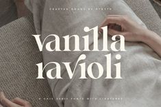 a woman laying on top of a couch under a blanket with the words vanilla ravioli