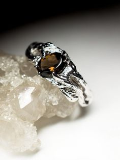 Silver ring with natural Smoky Quartz quartz origin - Brazil stone weight - 0.7 carats average ring weight  - 2.96 grams available ring sizes - 4; 4.5; 5.25; 6; 6.25; 6.5; 7; 7.5; 7.75; 8.25; 8.75 US  stone measurements - 0.12 x 0.2 x 0.28 in / 3 х 5 х 7 mm ref No 9296 Worldwide shipping from Berlin, Germany Citrine Gemstone Ring With Round Cut, Citrine Gemstone Promise Ring, White Gold Citrine Promise Ring, Citrine Prong Setting Promise Ring, Citrine Promise Rings With Round Cut, Citrine Promise Ring With Prong Setting, Promise Ring With Citrine Center Stone, Solitaire Citrine Ring For Anniversary, Nature-inspired Gemstone Rings For Anniversary