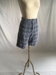 "vintage 1990s shorts label- Free Fall cotton fuzzy flannel  plaid purples, green, yellow, white 5 pockets 5 belt loops zipper fly w/button waist top good vintage condition, light wear label size 30, see below measures, lying flat, waist-14 1/2\" to 15\" pulled taught rise-13\" hip-20\" inseam-9\" hem-10 3/4\" outer length-19\"" Casual Plaid Bottoms With Belt Loops, Cotton Shorts With Belt Loops For Fall, Cotton Shorts For Fall, Retro Short Bottoms For Fall, Cotton Shorts With Short Leg For Fall, Cotton Shorts For Fall With Short Leg, Cotton Fall Shorts With Short Leg, Fitted Green Shorts For Fall, High Waist Cotton Shorts For Fall