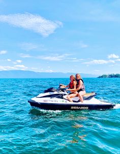 two people on a jet ski in the water