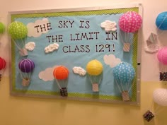 the sky is the limit in class bulletin board with hot air balloons attached to it