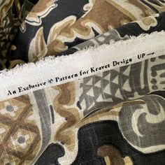 closeup of the fabric with words on it that read, an expensive pattern for kravet design