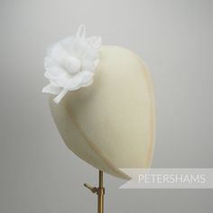 Need a silk flower on the smaller side? This petite 'Norma' flower is made from layers and layers of silk, with each petal being shaped and bound together on a wired stem with a set of wired leaves and rolled loops at the back. The fabric is a really lightweight, floaty silk and it hardly weighs a thing. Simply perfect for adorning a hat or headpiece. Flower measures approximately 8cm (3.1 inches) Length of wired stem: 7cm (2.7 inches) For our full range of silk hat flowers visit our Etsy shop h Elegant Flower-shaped Hair Accessories With Handmade Flowers, Elegant Handmade Flower Hair Accessories, Elegant Flower Hair Accessories With Handmade Flowers, Elegant Adjustable Fascinator With Flower Decoration, Elegant Flower-shaped Mini Hat For Garden Party, Elegant Flower Mini Hat For Garden Party, Elegant Flower-shaped Adjustable Fascinator, Elegant Adjustable Flower Fascinator, Elegant Flower Headpieces For Gifts