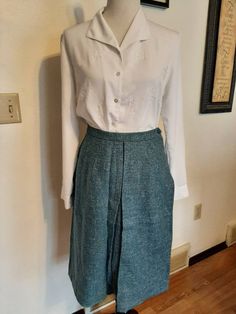 "Mid Century Womens Office/Career Wool A-Line/Pencil Skirts Size S-M/Vtg Lot 4 Wool Skirts Very Good Wearable Condition. Came From An Estate Sale And Need To Be Cleaned From Being Stored. Knee Length Or Slightly Longer Depending On Height. Fairly Soft Wool Fabric/Not Scratchy Lavender Lined Kerrybrooke Pencil Skirt Wool/Acetate Lining 1\" Waistband/Lavender 7\" Side Metal Zipper/1 Button Top Stitching and Front Kick Pleat (1 Tiny Hole Inside Pleat) Waist 27\" Hips 40\" length 26\" Black/Cream/Gr Vintage Long Skirt With Relaxed Fit, Vintage Spring Workwear Bottoms, Vintage Lined Skirt For Fall, Vintage Full Skirt With Lining, Classic Full Skirt Bottoms With Pockets, Retro Full Lined Skirt, Retro Spring Daywear Bottoms, High Waisted Lined Skirt For Daywear, Vintage Long Lined Skirt