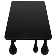 a black table that has two small drops on the top and one is upside down