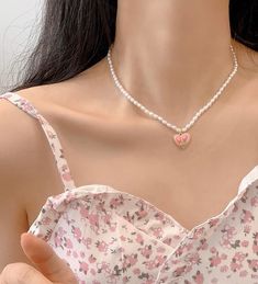 Introducing our stunning pink tulip pendant pearl beaded necklace choker, the perfect statement piece to elevate any outfit! Handcrafted unique design features a delicate pink tulip pendant, complemented by lustrous faux pearl beads for a touch of elegance and sophistication. This beautiful necklace is the perfect accessory for any occasion, whether it's a romantic dinner date, a night out with friends, or a special event. The floral design is perfect for spring and summer, adding a touch of fem Pink Pearl Necklace With Heart Beads Gift, Cute Pink Pearl Necklace, Pink Choker Necklace For Spring, Feminine Pearl Beaded Necklaces, Pink Heart-shaped Pearl Necklace, Dainty Pink Pearl Beaded Necklaces, Heart-shaped Pink Pearl Necklace, Cute Pink Necklace For Spring, Pink Pearl Necklace For Valentine's Day