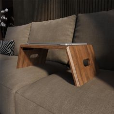 a wooden table sitting on top of a couch