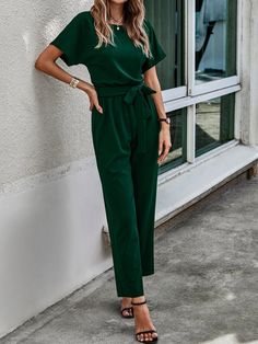 Dressing up for a wedding, gala, or any other special occasion is a breeze in the jumpsuit. A flattering fit that highlights your contours is provided by the belted waist, which also gives a feminine touch with its dark green color. The Keyhole Back Jumpsuit allows for free mobility and flexibility because of its regular fit and comfy materials, enabling you to dance the night away without any difficulty. Features: Color: Dark Green Style: Casual Pattern Type: Plain Details: Belted, Cut Out Length: Long Type: Tee Fit Type: Regular Fit Neckline: Round Neck Sleeve Length: Short Sleeve Sleeve Type: Batwing Sleeve Waist Line: High Waist Fabric: Medium Stretch Jumpsuits Material: Fabric Jumpsuits Composition: 95% Polyester, 5% Elastane Care Instructions: Machine wash or professional dry clean J Style Vert, Stretch Jumpsuit, Comfy Jumpsuits, Batwing Sleeve, Green Fashion, Green Colors, Dark Green, Types Of Sleeves, Special Occasion