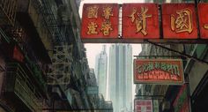 an alleyway with chinese signs and buildings in the backgrouns, hong kong