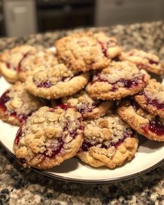 a white plate topped with cookies covered in jelly