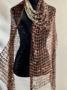 Transform your evening ensemble with our exquisite evening wrap, where sequins illuminate the sheer chiffon, creating a dazzling effect that catches every eye. This see-through shawl features a delicate tassel weaving design, adding a touch of sophistication to any occasion. Perfect for evenings, parties, weddings, or even as a stylish sun protection accessory. Material: Sheer lace adorned with sequins Dimensions: 20" x 60" Explore more captivating designs at our Etsy store, T4ArtPrint. Should you have any questions, feel free to reach out. Thank you! Evening Wrap, Sequin Scarf, Brown Scarf, Evening Wraps, Evening Shawls, Brown Scarves, Sequin Wedding, Wedding Cape, Weaving Designs