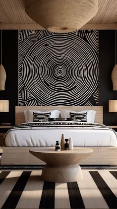 a bedroom with black and white decor on the walls