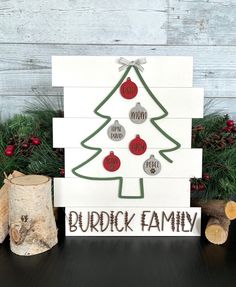 a wooden christmas tree with ornaments on it and the words burdick family below