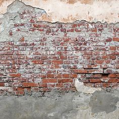 a red fire hydrant sitting in front of a brick wall with peeling paint on it