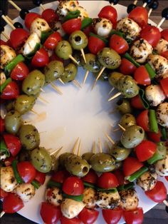 an arrangement of skewered vegetables arranged in a circle