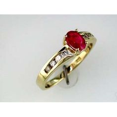 Royal 14K Yellow Gold Ring with Oval Ruby and Round Diamonds - 0.69 Carat Total Gem Weight Ruby And Diamond Ring, Stage Set, Ruby Stone, Royal Jewelry, Yellow Gold Ring, Center Stage, Gold Band, Yellow Gold Rings, Gold Bands