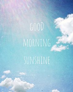 the words good morning sunshine are written in white on a blue sky with fluffy clouds