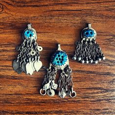 I recently acquired a large amount of these awesome hand made pendants/dangles from Pakistan. These are great as focal pendants, keyrings or even for costuming.  There's some really beautiful pieces available & if I have doubles (or more) pof one design I'll list them for sale together.  I'm not going to write an "in depth description" of each piece as it would be too time consuming for me but I can tell you that if they have stones they are either glass or synthetic, the chains are all handmade & the coins are older. Many of these pieces have been removed from vintage costumes.  ❤️ Vintage Brass Dangle Charm Necklaces, Collectible Silver Dangling Charms, Vintage Brass Charms With Dangling Details, Antique Collectible Dangling Charms, Antique Silver Hallmarked Charms, Metal Pendant, Vintage Costumes, One Design, Jewelry Necklace Pendant