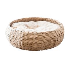 a dog curled up in a wicker bowl