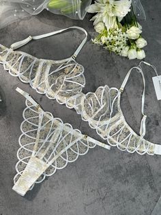 Introducing "Heavenly Glow Radiance Luxe Lingerie Set," a celestial blend of white satin and golden thread embroidery, creating an ethereal lingerie experience. Elevate your moments with the divine touch of opulence. ✨ ✨ Material: Made of 90% Polyester, 10% Elastane. Exquisite Embroidery Design: The lingerie set features intricate embroidery, adding delicate patterns for an alluring appeal. Comfortable and Form-Fitting: Lightweight Padded-free Underwire Bra. Crafted from soft and smooth fabric, Luxury Full Cup Intimates With Delicate Lace, Luxury Satin Intimates With Delicate Lace, Cheap White Delicate Lace Intimates, Luxury White Lace Intimates, Luxury Sheer Satin Intimates, Red Lingerie, Lace Lingerie Set, La Girl, Lingerie Fashion