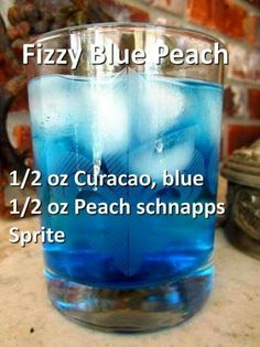 a blue drink in a glass with ice on the rim and text that reads fizzy blue peach