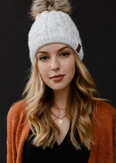 Warehouse Sale Special!  Nothing says I'm winter ready quite like our new pom hat! This gorgeous white braided cable knit winter hat with a faux fur pom accent is a chic and stylish winter accessory to add to your collection. White braided knit hat  Natural faux fur pom accent Fleece lined Crown patch on the left side One size Designed in the U.S.A. Produced in China.  100% Acrylic *This item is a sale item and is final sale. It will not be eligible for returns or exchanges. White Beanies, Cable Knit Hat, Snow Angels, Preppy Girl, Winter Hats For Women, Girl Fits, Pom Pom Hat, Fur Pom Pom, Winter Knits