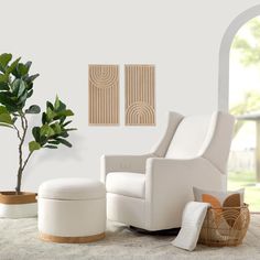 a white chair and ottoman in a living room with potted plant on the floor