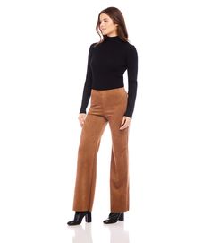 The Presley Pants are made with faux suede material, providing a soft and comfortable fit. The raw hem adds a touch of uniqueness to these pants. In a warm cognac color, these pants are the perfect addition to any fall wardrobe. True to size Faux Suede: 93% Polyester 7% Spandex Made in the USA of Imported Fabric Hand Wash Cold Separately, Do Not Dry Clean Length: Full length Wide-leg Elasticized waistband Front rise: 11 3/8 inches (size M) Inseam: 31 1/2 inches (all sizes) Leg opening: 21 inches Stretch Brown Wide Leg Pants For Workwear, Brown Suede Bottoms, Chic Brown Suede Bottoms, Brown High-waisted Leather Pants For Winter, Brown Wide Leg Trousers For Fall, Elegant Brown Pants For Fall, Fall Brown Wide-leg Leather Pants, Brown Wide Leg Cargo Pants For Fall, Elegant Brown Leather Pants Full Length