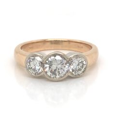 three stone diamond ring in yellow gold