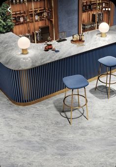 two blue stools sitting in front of a bar