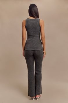 Delicately crafted. The SHYANN Sleeveless Longline Knit Top is a chic and modern essential for any wardrobe. This top features a classic round neckline and a flattering bodycon fit, accentuating your silhouette with its sleek, unlined knit construction. The longline design adds a touch of elegance, making it perfect for layering or wearing on its own. Pair it with the Shyann Straight Leg Knit Pant for a coordinated and sophisticated look that is both comfortable and effortlessly stylish, ideal f Fitted Full Length Knit Pants, Luxury Stretch Ribbed Pants, Ribbed Full-length Loungewear Pants, Full-length Stretch Knit Bottoms, Solid Ribbed Knitting Casual Sweater & Pants Sets, Workwear Capsule Wardrobe, Workwear Capsule, European Summer Outfits, Beige Dresses