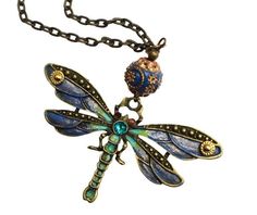 "Just the necklace to choose when you want to add a vintage look with artful charm to your outfits! A beautiful dragonfly pendant is accented in enchanting colors...shimmering violet, chartreuse green, and turquoise, giving it a mystical quality as it dangles whimsically below a gorgeous handmade Indonesian bead! A couple of metal rounds accent the spread wings and crystal rhinestones add a little sparkle to the eyes and middle! Just choose your fave necklace length and add this stunning piece of wearable art to your collection! Antiqued Gold-plated Necklace w/ Lobster Clasp, 18\"-30\", Antiqued Gold-plated Dragonfly Pendant, 3\" wide, 1 3/4\" high, Handmade Indonesian Bead, 5/8\"  MANY ARTFUL ITEMS ARE AVAILABLE IN MY SHOP! VISIT MY SHOP GODDESS ARTS COLLECTION www.etsy.com/shop/goddessar Vintage Handmade Dragonfly Necklace, Handmade Vintage Dragonfly Necklace, Vintage Handmade Dragonfly Jewelry, Long Art, Beautiful Dragonfly, Chartreuse Green, Dragonfly Necklace, Painted Jewelry, Hand Painted Jewelry