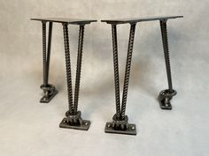 two small metal tables sitting next to each other