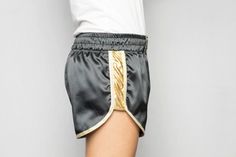 Short shorts ZAT GOLD DUST satin polyester black bands sides fabric gold Bordered by white gold bias Badge belt logo ZAT embroidered black on gold Elastic belt Size S (36/38) Materials: -black satin: polyester 97%, elastane 3% -golden fabric: polyamide 95%, elastane 5% Machine washable at 30oC upside down Gentle ironing Sportswear and canon Can be ordered in other sizes Made in France Christmas gift / Gift for her / Gift for him / Birthday gift Short Satin, Nylon Shorts, Satin Noir, Elastic Belt, Gold Dust, Gold Border, Short Shorts, Short Girls, Belt Size