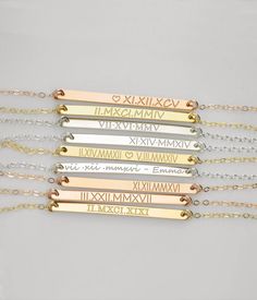 A simple yet beautiful way to commemorate a special day or moment in time with this Roman numeral dainty bar necklace. Perfect for wedding date, engagement, first date, or any other anniversary. ✭ Character limit of 20 on each side. Please note this necklace is not eligible for a return or refund. ✭ Bar is 3mm x 40mm. Model is wearing 16 inch necklace. - - - - - - - - - - EVERYTHING is customizable! METAL OPTIONS ✦ 14K yellow gold filled ✦ 14K rose gold filled ✦ 925 Sterling Silver CHAIN LENGTH Minimalist Bar Necklace For Anniversary Or Mother's Day, Elegant Hand Stamped Necklaces For Wedding, Minimalist Rose Gold Bar Necklace For Anniversary, Customizable Gold Bar Necklace For Anniversary, Elegant Custom Name Bar Necklace For Anniversary, Minimalist Custom Name Bar Necklace For Anniversary, Classic Silver Bar Necklace For Anniversary, Personalized Bar Necklace For Anniversary, Silver Custom Name Bar Necklace For Anniversary