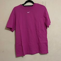 Nike Essentials Shirt - Fuchsia/Pink White Nike Swoosh Has An Oversized Fit Brand New With Out Tags Perfect Condition Never Worn No Flaws Basic Pink Summer Shirt, Nike Purple Tops For Spring, Sporty Pink Tops With Relaxed Fit, Nike Sporty Pink T-shirt, Sporty Short Sleeve Pink Shirt, Pink Relaxed Fit Crew Neck Shirt, Sporty Pink Nike T-shirt, Pink Sporty Crew Neck Tops, Sporty Pink Crew Neck Tops