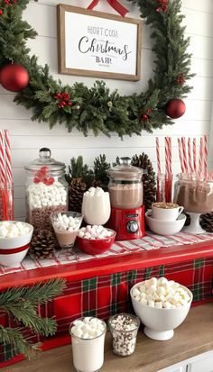 a christmas candy bar with hot chocolate, marshmallows and other holiday treats