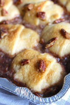 a pan filled with baked goods sitting on top of a table