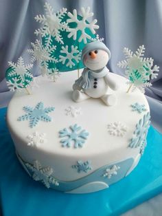 a frosted cake with snowflakes on it